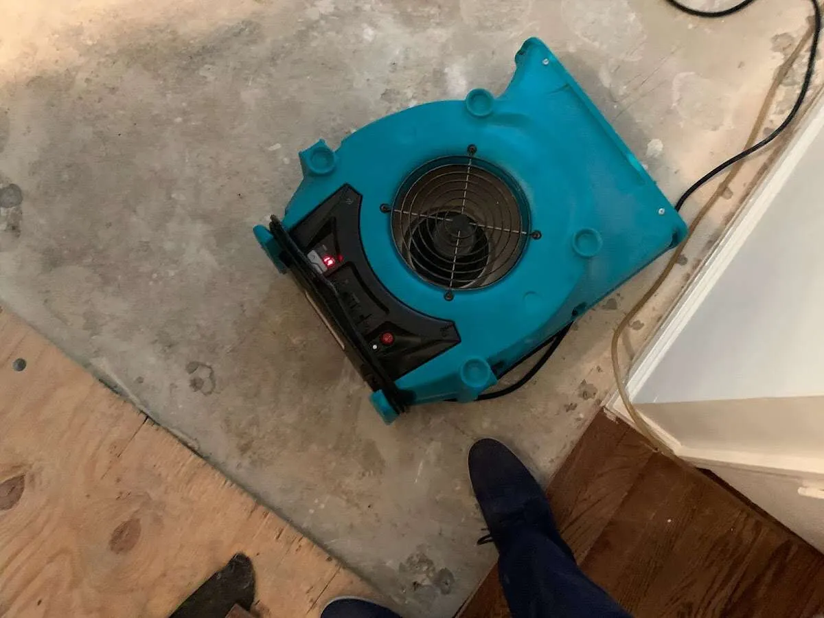 Air mover drying subfloor during Leak Detection & Repair in Boiling Spring Lakes